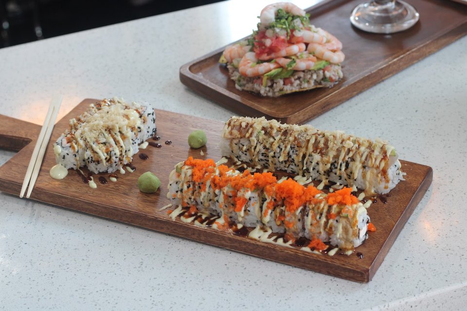 Colorful seafood dishes in a simple dining space.